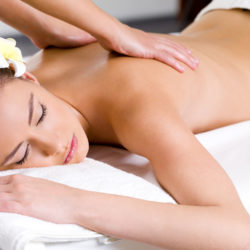 Beautiful woman having relaxing massage  in spa salon